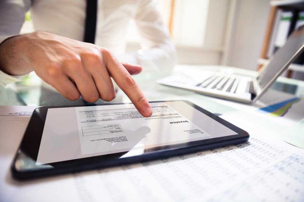 image of a Businessperson analyzing invoice sent through billing automation