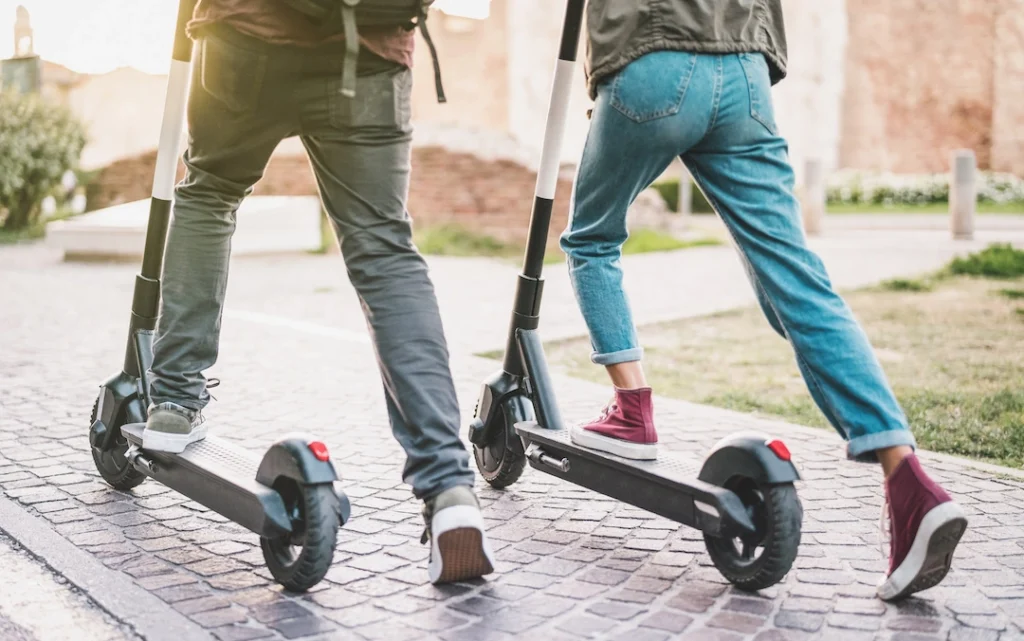 Example of a pay as you go business model: two people using an e scooter